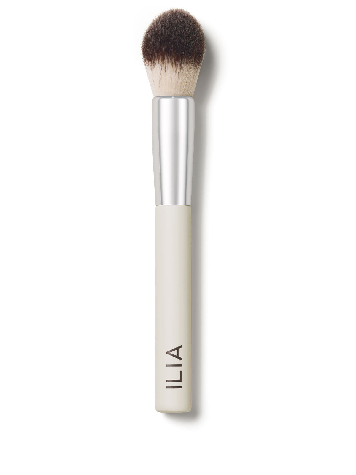 A close-up of the Precision brush with a white handle and dense, dual-toned bristles.